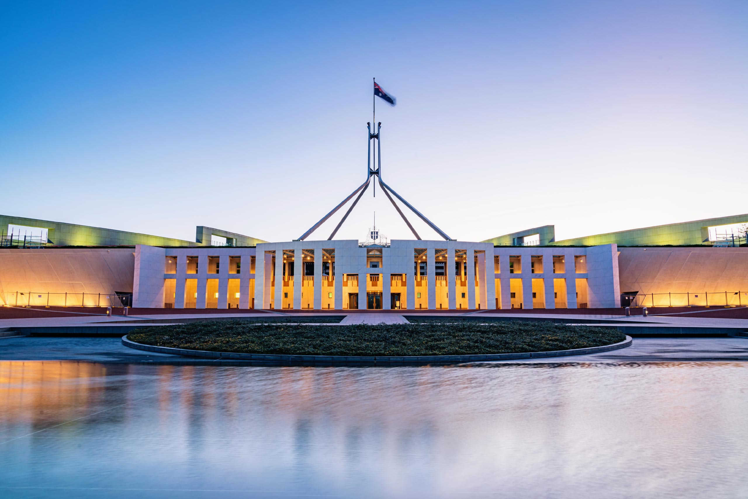 Parliament House, Canberra, seen in twilight.