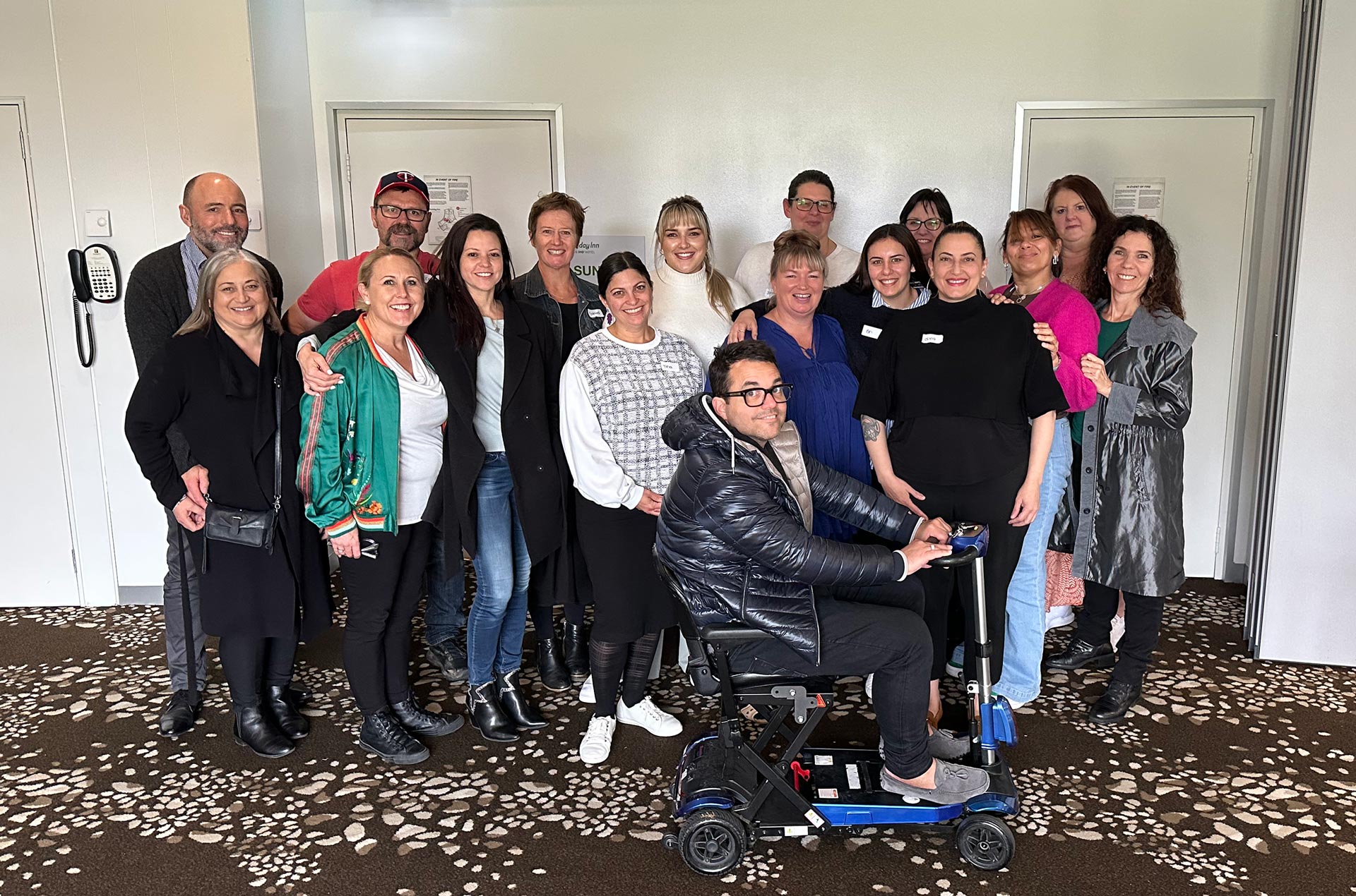 Young Onset Parkinson’s National Working Group. Group photo showing group members and Parkinson's Australia staff.